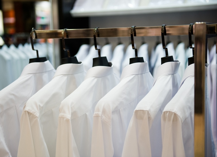 Clothes hung up for dry cleaning