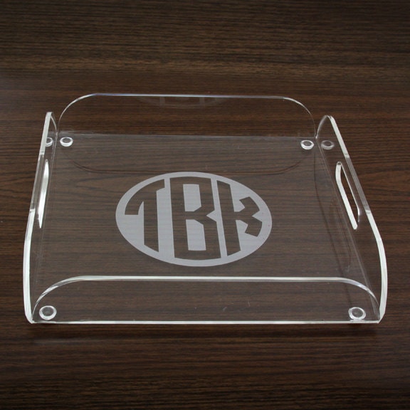Clear serving tray that's been personalized with the initials TBK. 