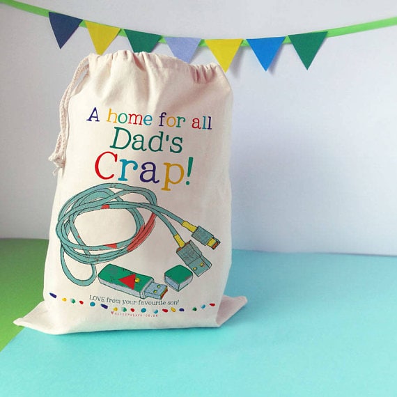 Tan bag that says A home for all Dad's crap! 