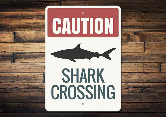 Gift ideas for shark lovers include this sign because sharks are indeed everywhere. 