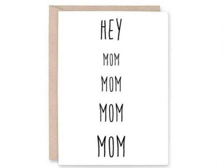White card with black front going down that says HEY MOM MOM MOM MOM. 