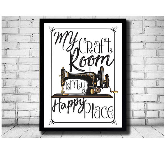 Black framed art print that says My craft room is my happy place with a black sewing machine. 