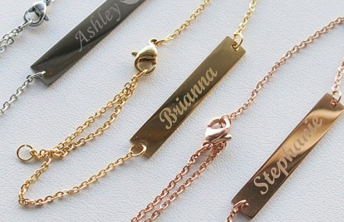 Silver, gold, and bronze rectangle personalized bracelets shown. 