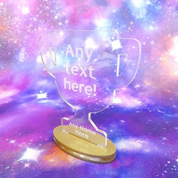 See through trophy shape light up that can be customized with any text. 