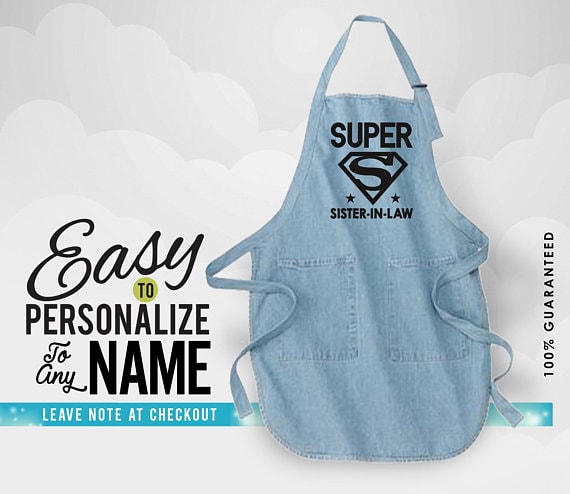 This apron is a fun mother's day gifts for sister-in-laws for her kitchen! Blue apron with black font that says Super sister in law. 