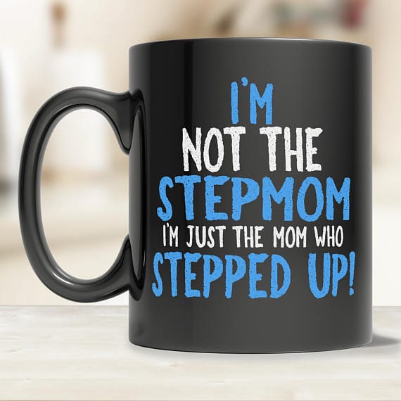 Mother’s Day Gifts for Step Moms: Black coffee mug with blue and white font that reads I'm no the stepmom I'm just the mom who stepped up! 