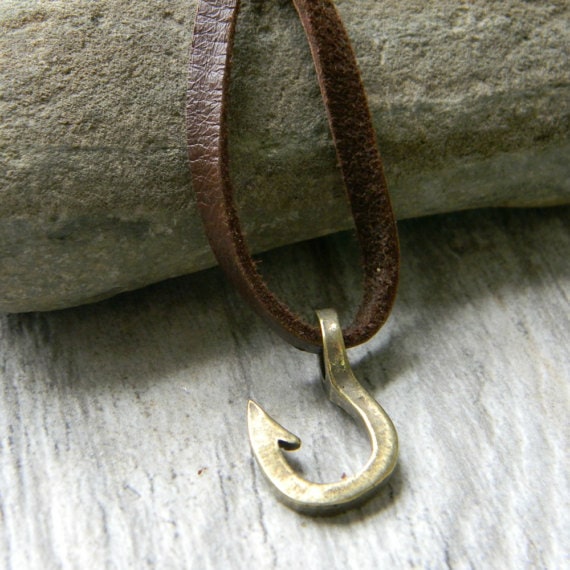 Brown leather necklace with a silver fishing hook. 