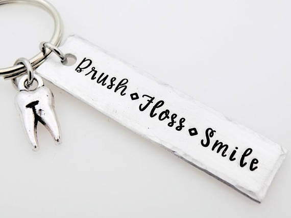This Gift Ideas for Dentists will make them smile every time they turn the keys. 