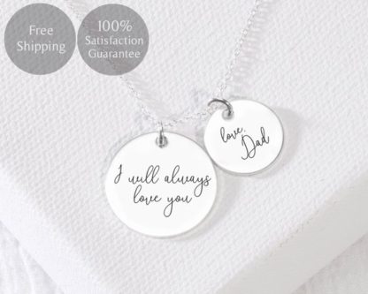 Silver necklace with round charms where you can put someone's handwriting on with special messages. 