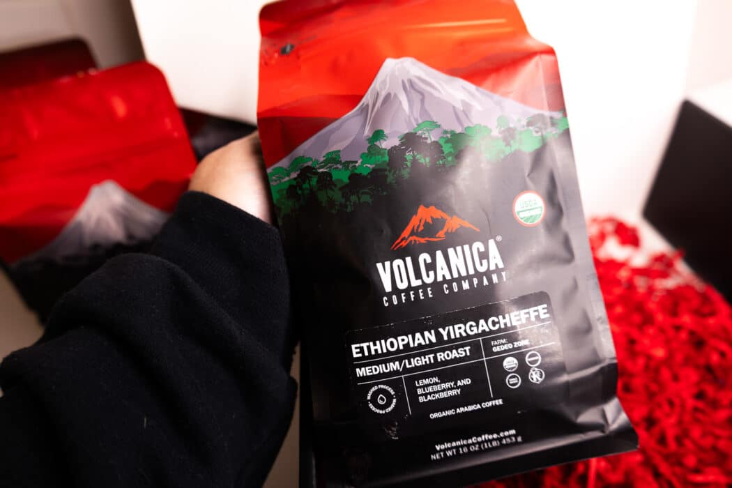 Holding Volcanica brand coffee from the gift box