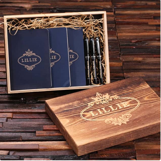 Personalized pen and journal set shown in an open wooden box.