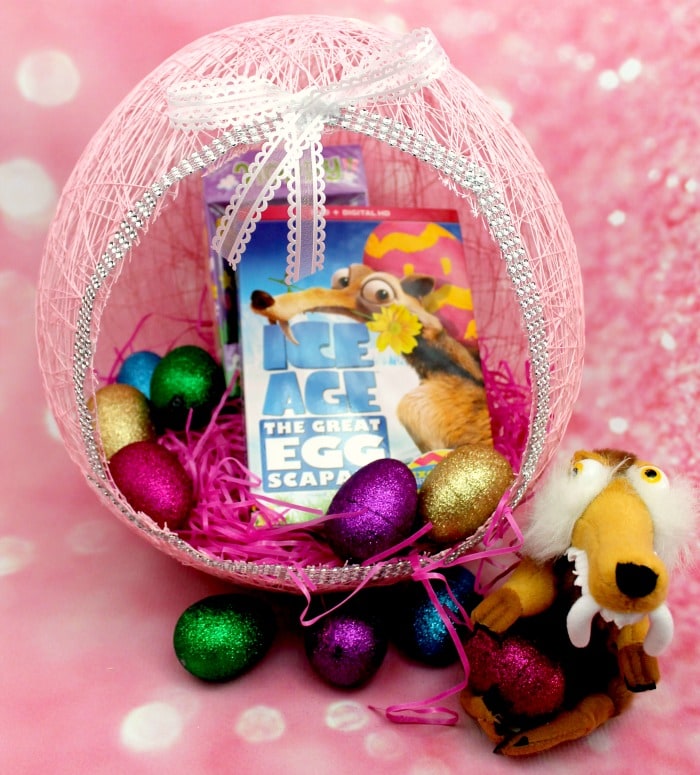 Pink Easter egg shaped using pink string and white lace bows, filled with Easter treats. 