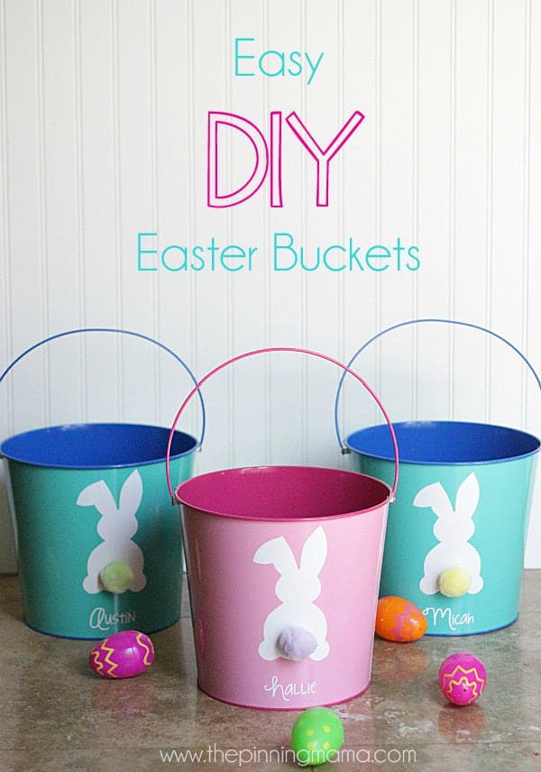 Three tin buckets all with white bunnies with a colorful pom pom as a tail, teal tin with Austin written below bunny, middle tin bucket with Hallie written below bunny, and blue tin bucket that says Micah on it below bunny. 
