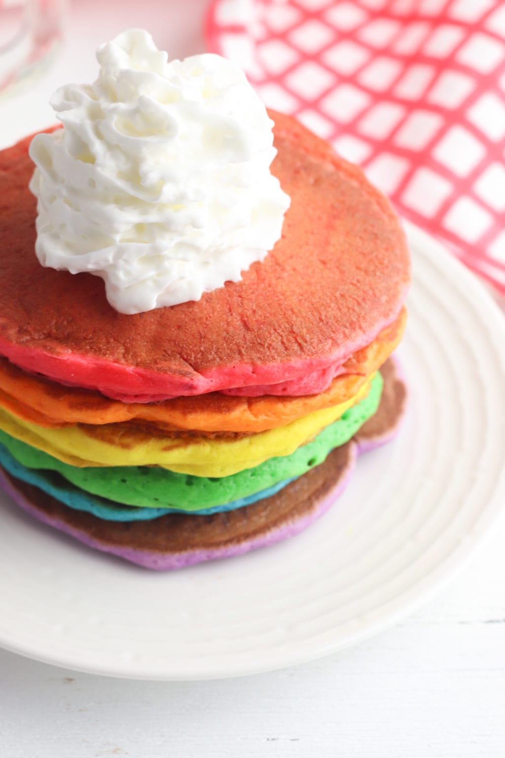 Close up of rainbow pancake stack