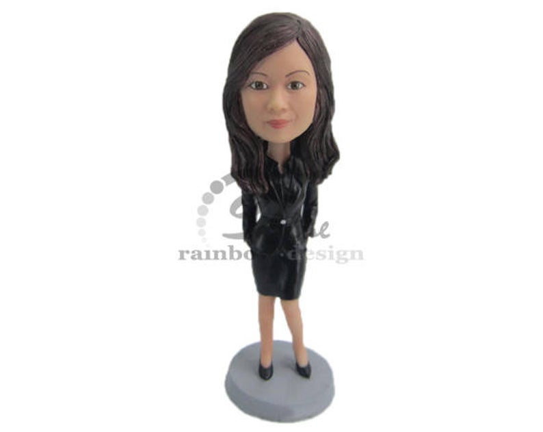 Custom bobbled of a woman in a black suit dress. 