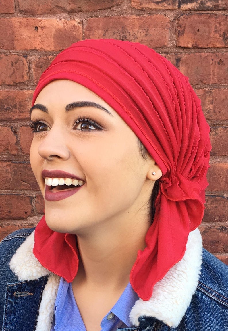 woman wearing a red head scarf.