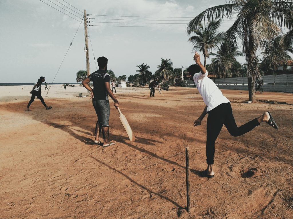 Teens playing games on the beach