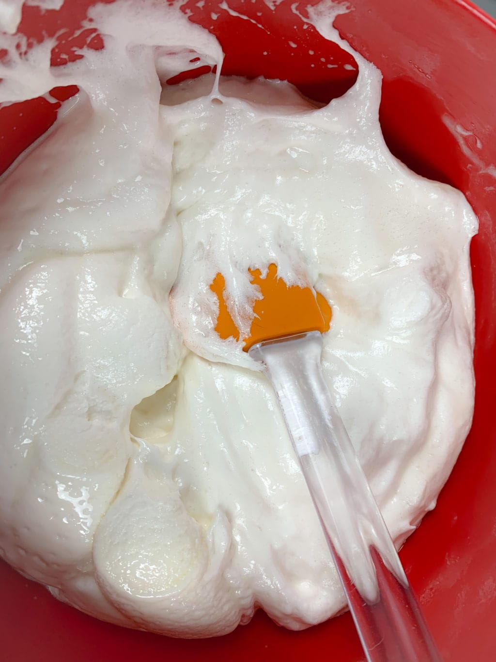 Showing melted marshmallows in a red bowl. 