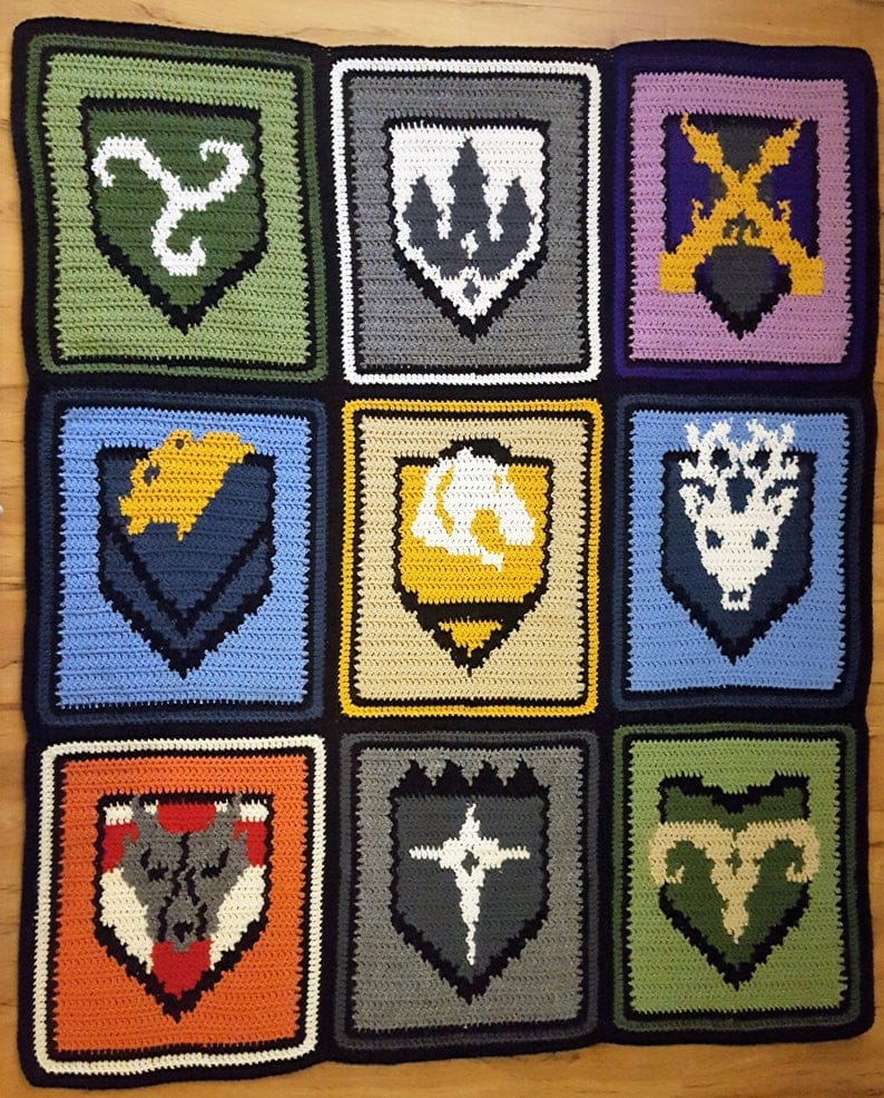 crochet blanket with Skyrim city logos on them 