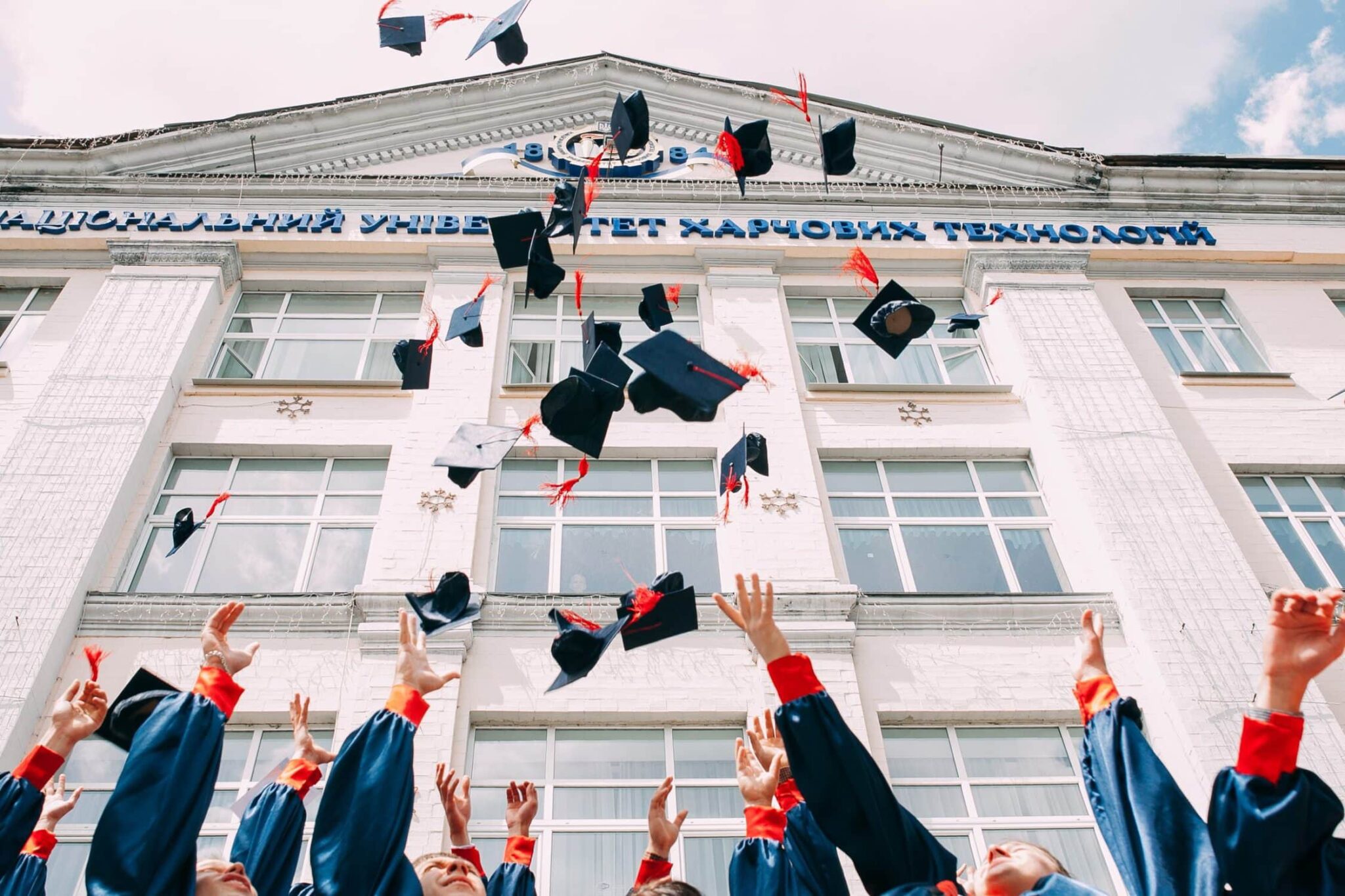 Graduates tossing their caps