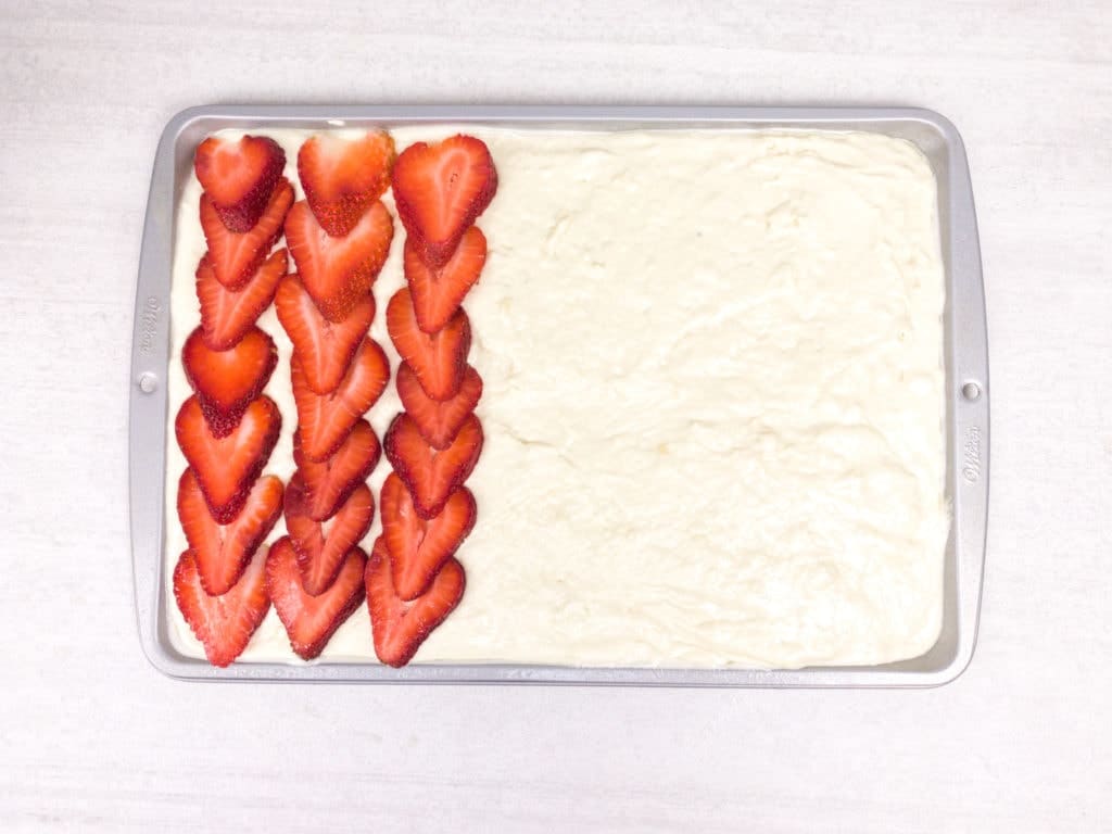 Topping with strawberries