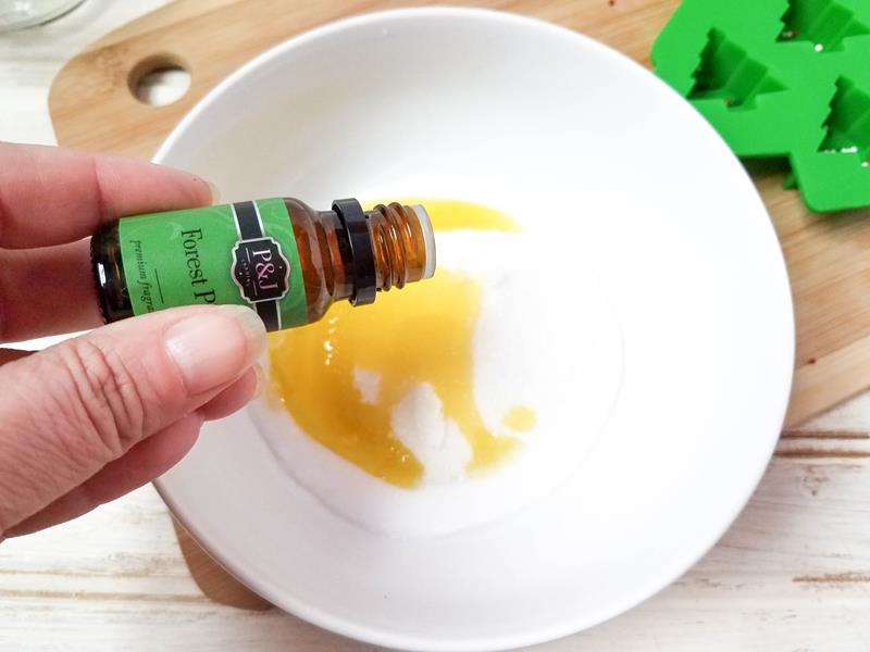 adding essential pine oil to bowl