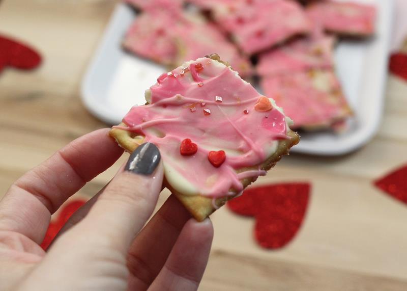 Woman's hand holding easy to make Valentine's Day crack recipe