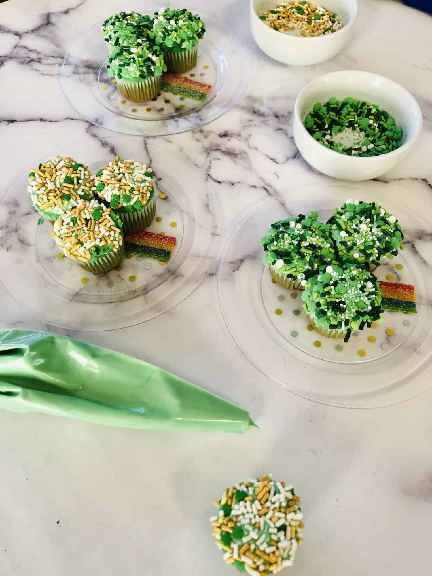 Mini cupcake shamrock recipe with green icing piping bag