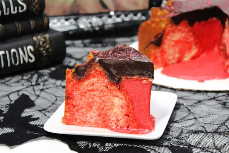 Halloween blood cake with chocolate ganache filling on a plate