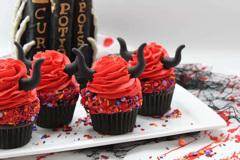 spooky red chocolate cupcakes on a white plate