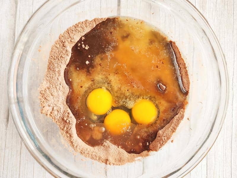 eggs cocoa poweder sugar and flour in a bowl