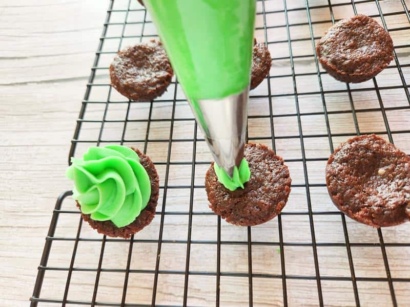 brownies with green icing on them