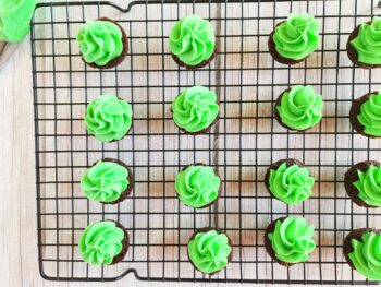 Christmas tree brownie recipe on a cooling rack with green food coloring