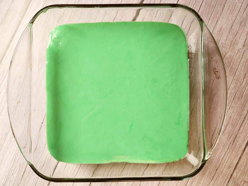 green frosting in a baking tray 