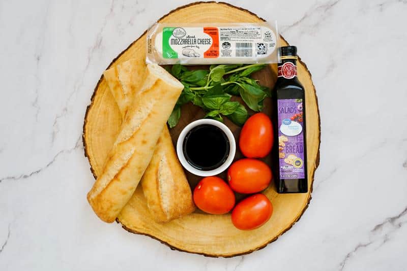 Ingredients for making a caprese cheese board