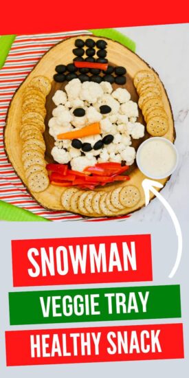 snowman shaped veggie tray on a serving tray