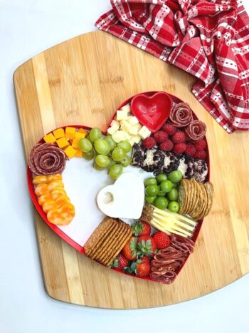 grapes, olives, and strawberries, and more meat now added to heart shaped box. 