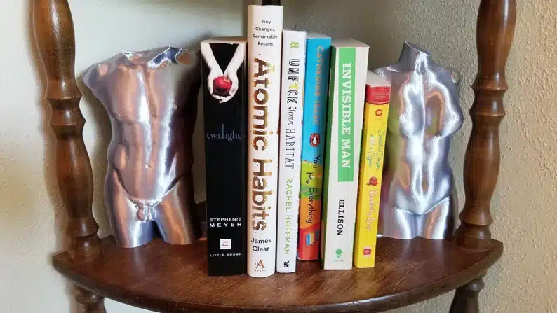 Male and female naked torso bookends