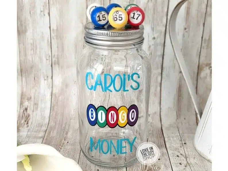 Mason jar that says "carol's bingo money"
