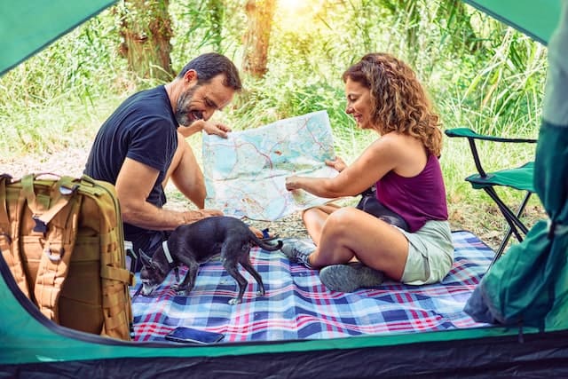 Couple camping outside together