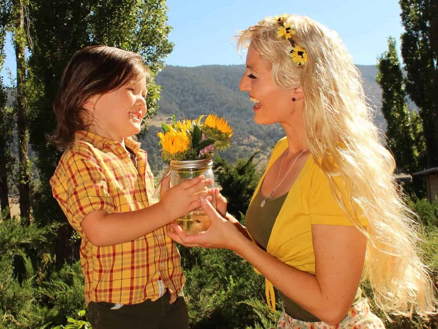 Son giving mom flowers for Mother's Day