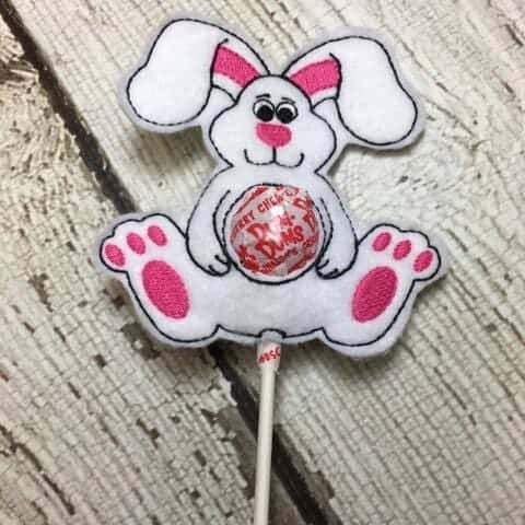 White bunny with a lollipop in the middle. 