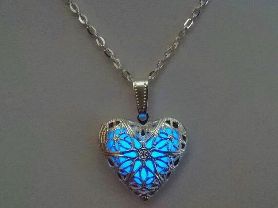 Glowing heart pendant necklace in blue