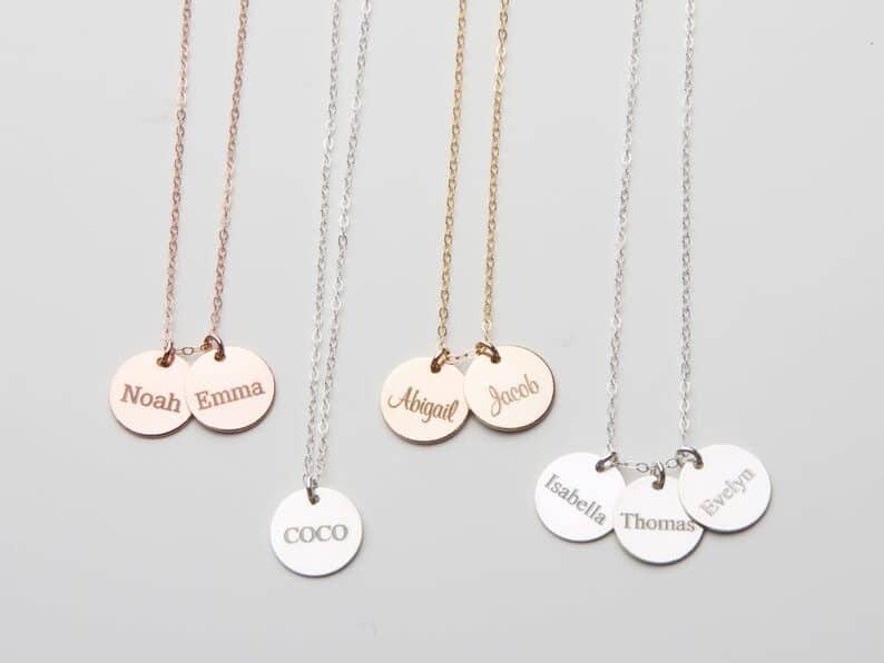 Quick & Easy Mother's Day Gift Ideas: Four different necklaces shown, two silver pink and two silver. all with names on the round charms.