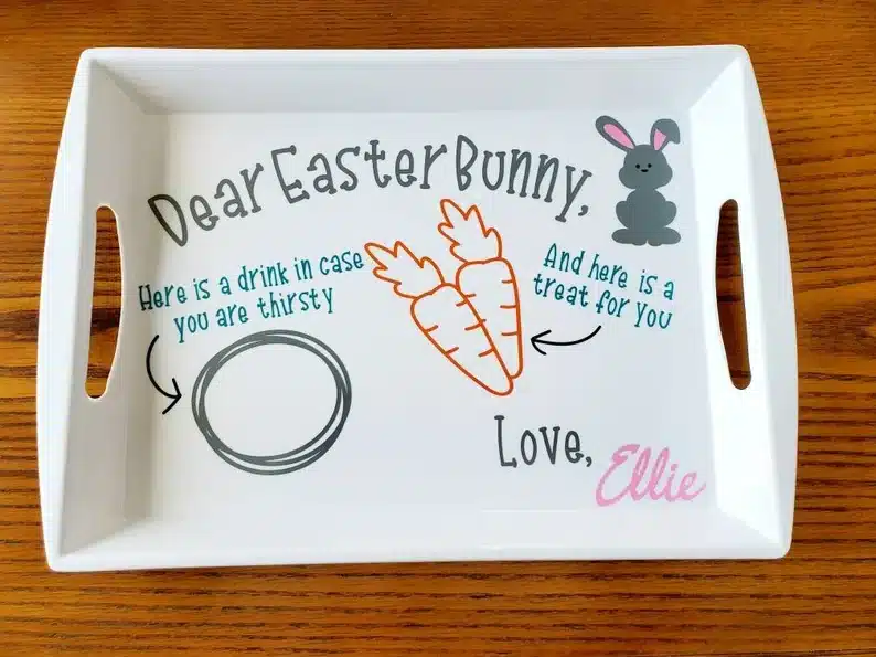 White tray with writing that says Dear Easter bunny, here's you drink, carrots, love Ellie. 