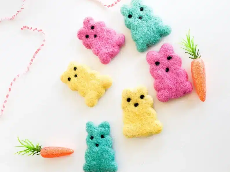 Easter Classroom Gifts for 7th Grade Students: six felt bunnies show, two yellow, two pink, and two teal. 