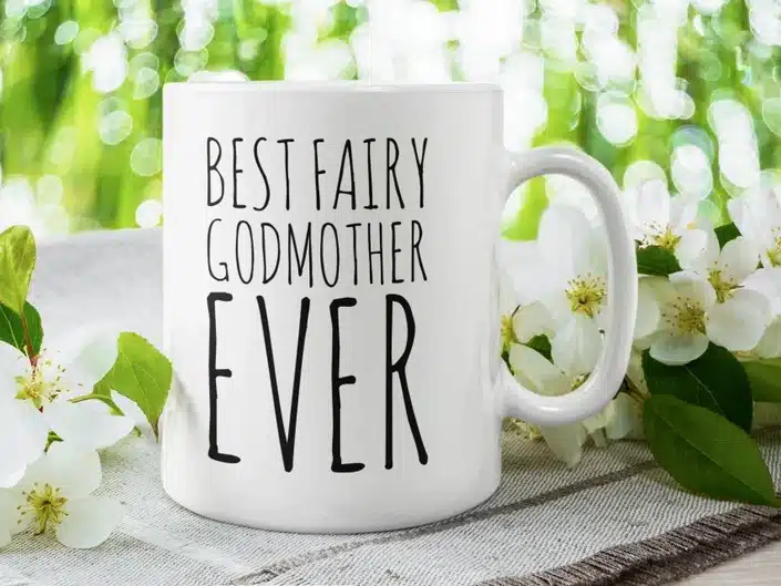 White coffee mug with black font that says Best Fairy Godmother ever. 
