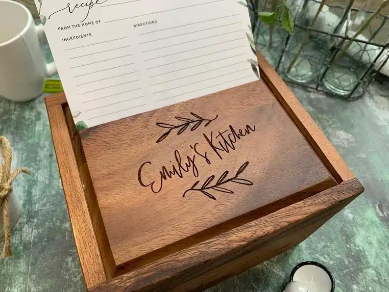 Wooden box that says Emily's kitchen engravened on top. 