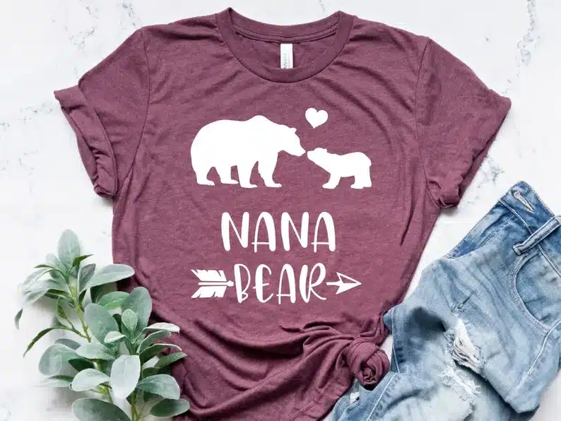 Light purple t-shirt with white silhouette or a mama bear and baby bear kissing that says NANA bear below. 