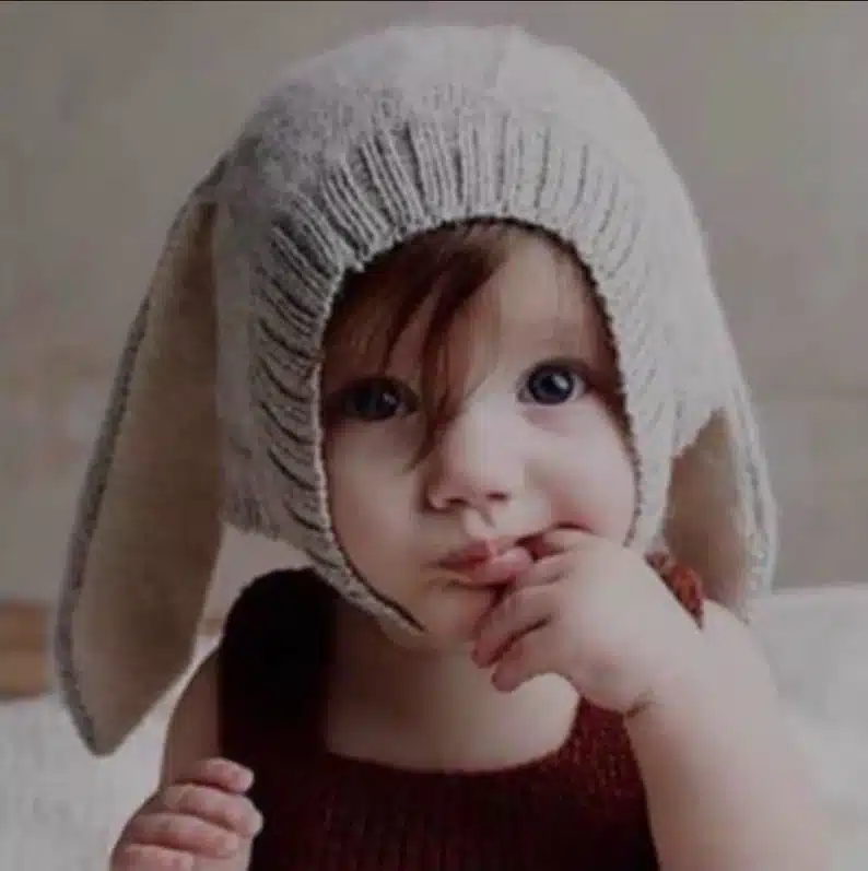 Easter Gifts for Toddlers: little toddler wearing a cream colored bunny hat. 